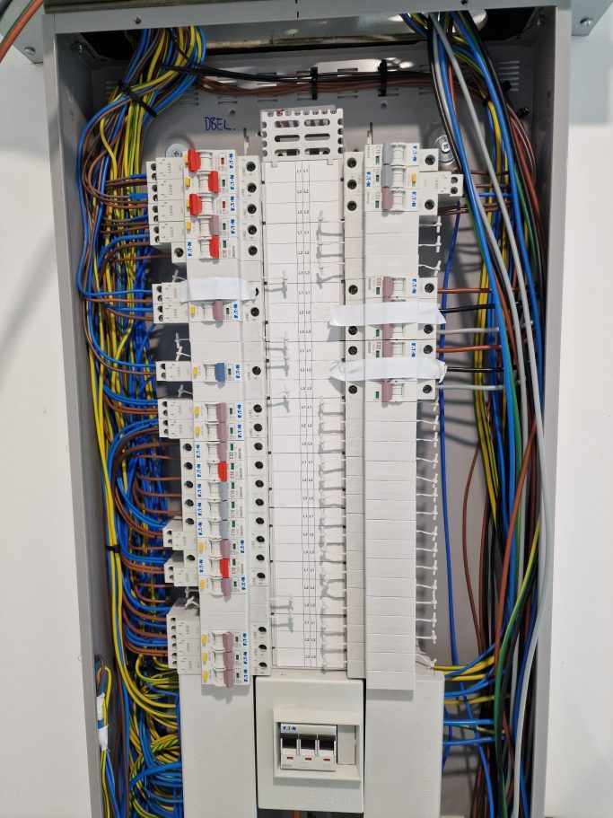 New three‑phase consumer unit with SPD installed, tidy wiring, and additional circuits added to meet customer requirements.